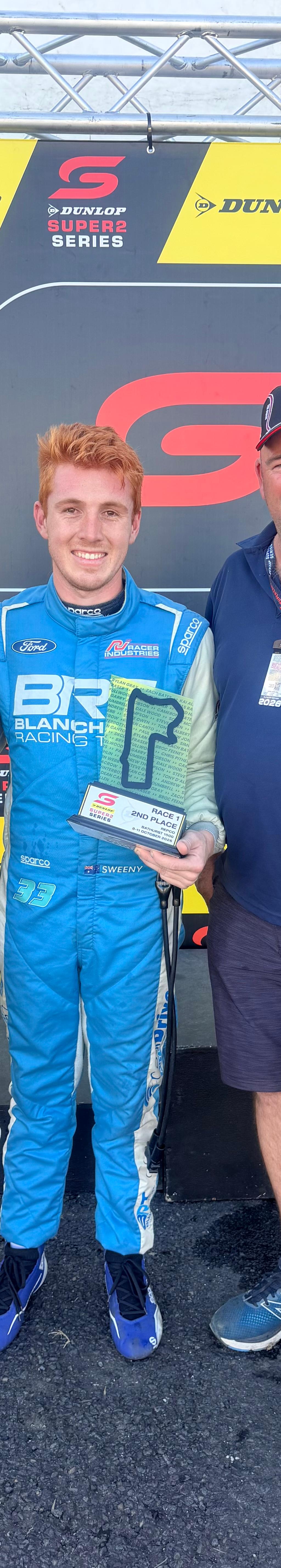 Bailey Sweeny with Harcourts Batemans Bay principals Omania Terry and Dene Lewthwaite at the Dunlop Super2 Series podium
